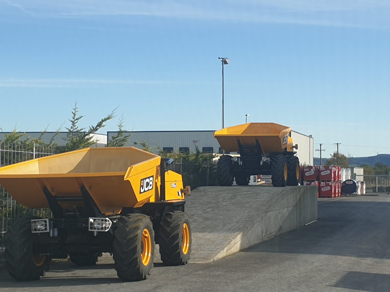 2 x ex rental JCB 6 Ton Dumpers SOLD to a customer in Florida . USA .. on the loading ramp ready for off